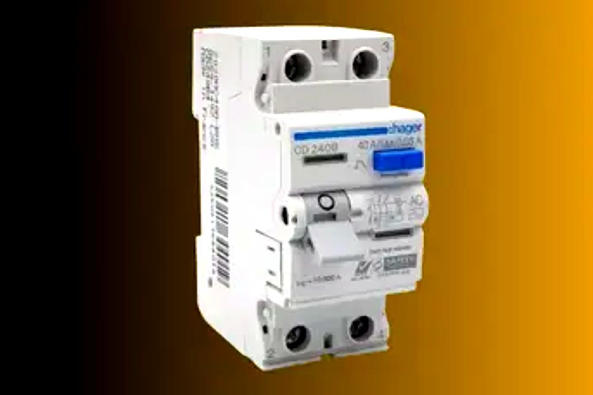 A professional electrician inspecting a faulty RCCB circuit breaker in a Singapore residential DB box.