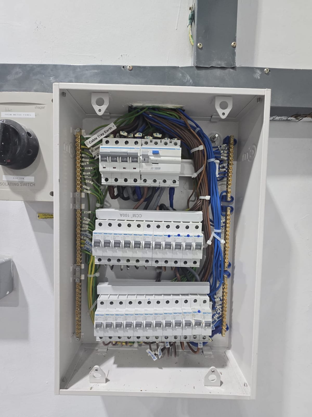 Licensed electrician in Singapore replacing an old DB box with a new unit, ensuring safe and reliable electrical distribution for residential and commercial properties.